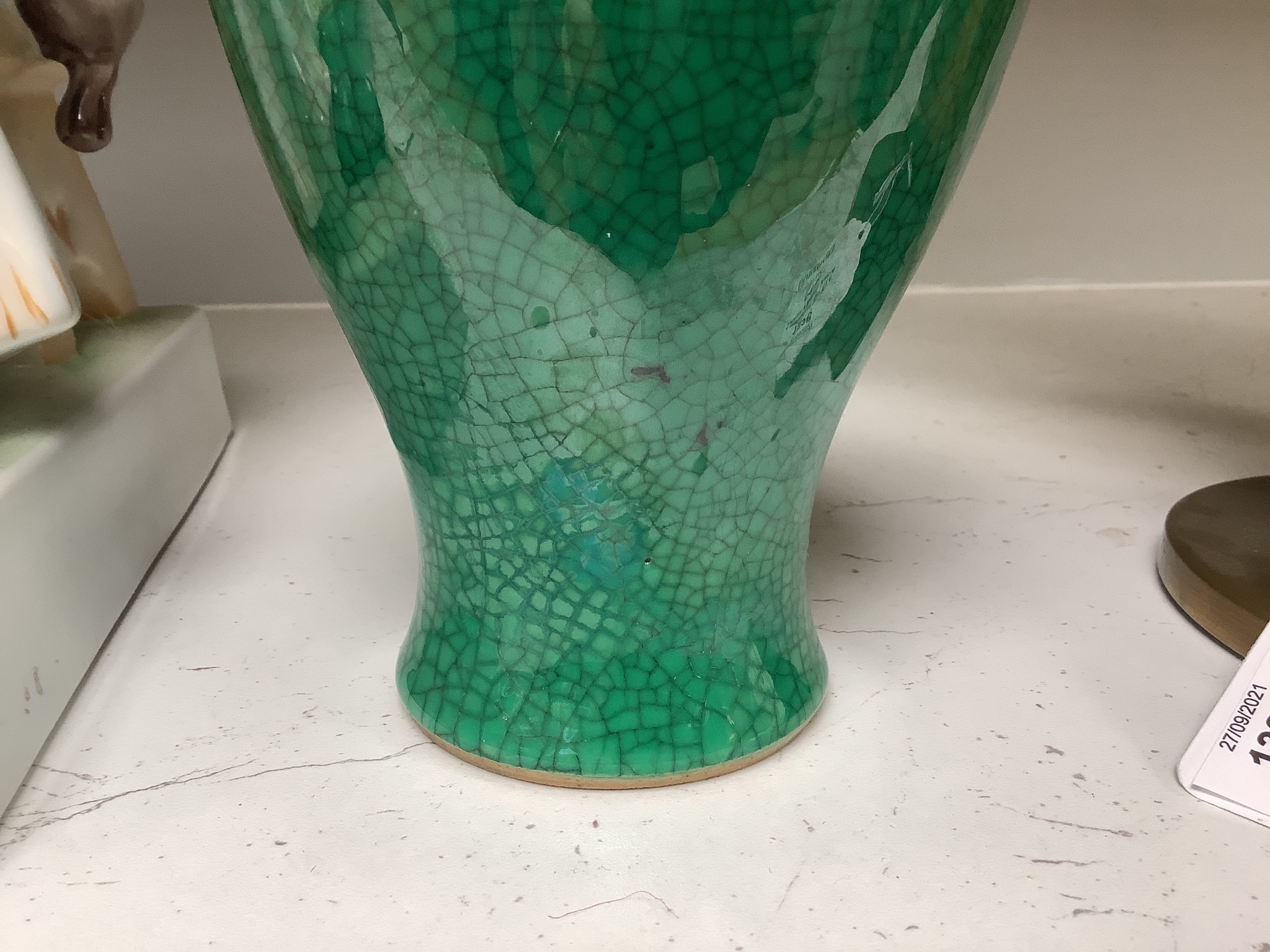 A Chinese green ground crackle glazed porcelain baluster vase, height 19cm